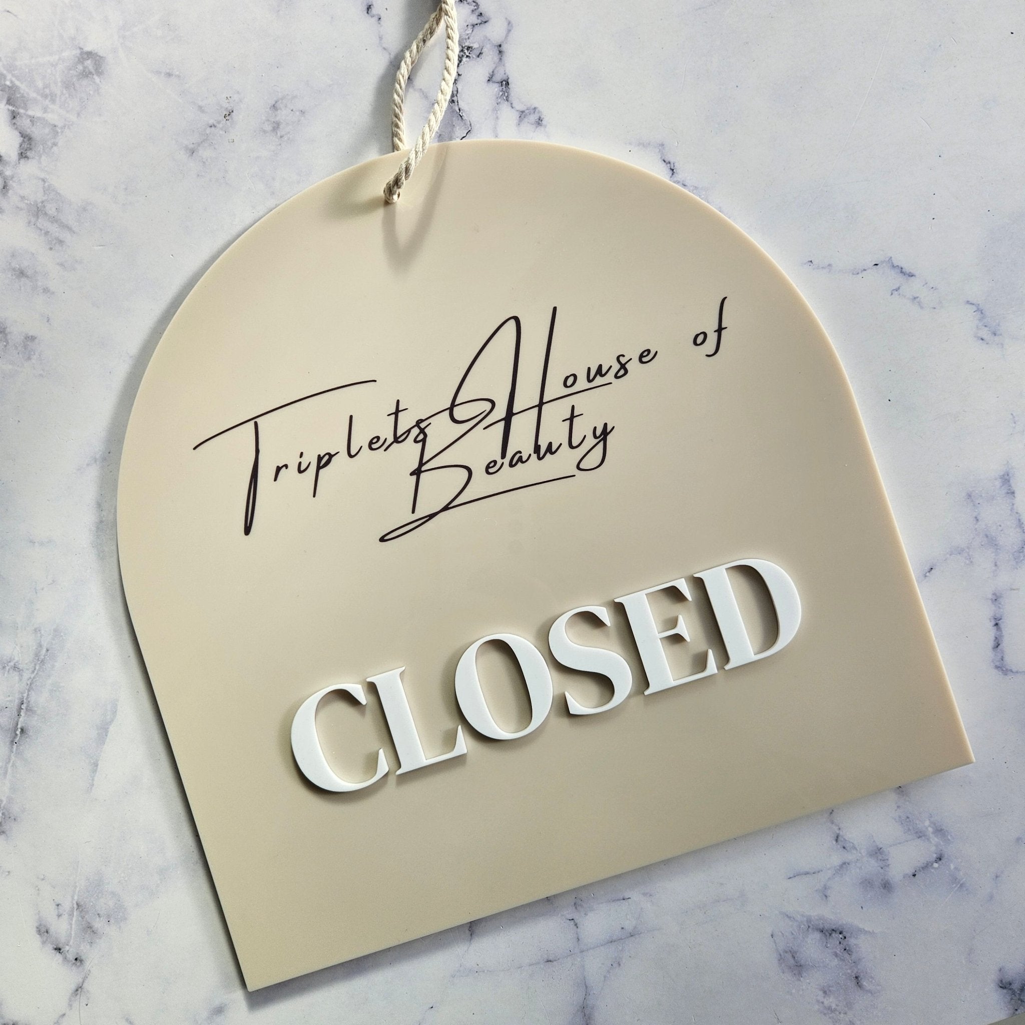 Closed sign in arch shape with 3D letters