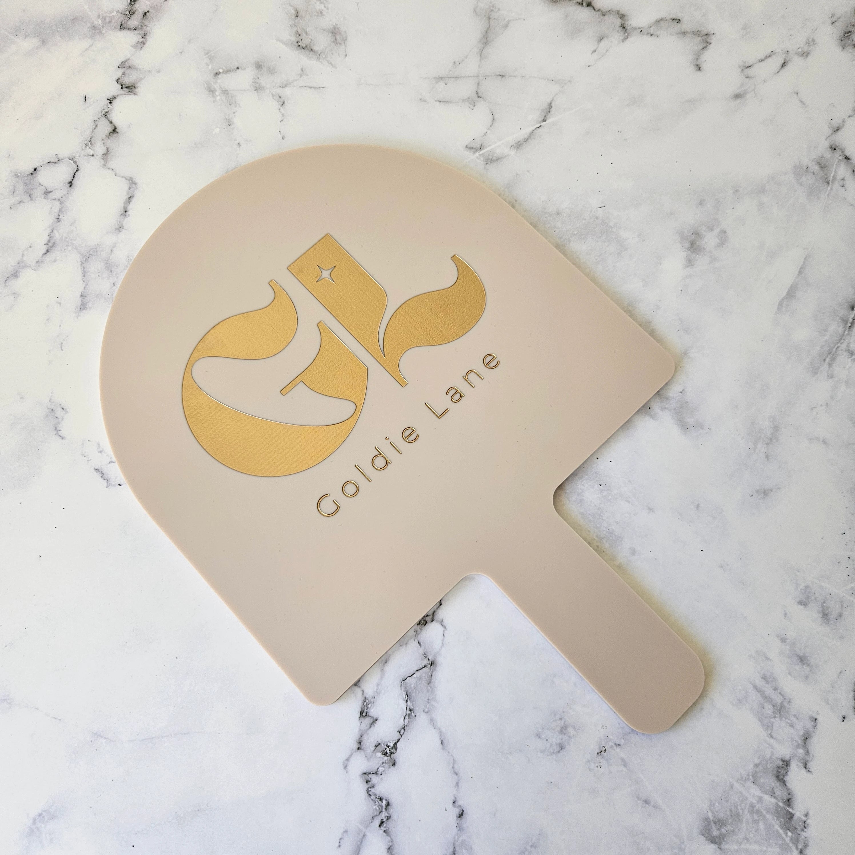 Arch Handheld Mirror Almond Acrylic and Gold Logo