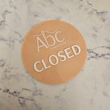 closed sign with raised 3D letters in white