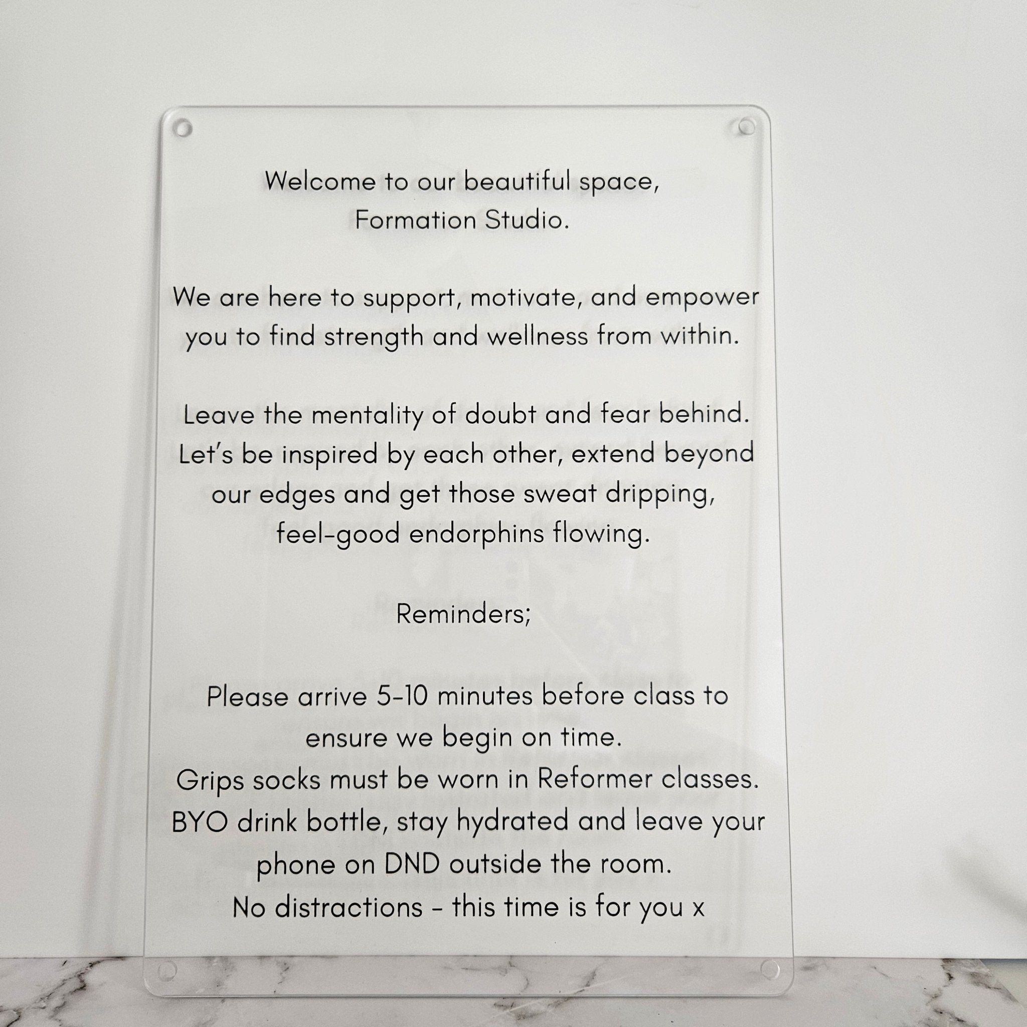 Custom signage for Pilates studio to turn off phone