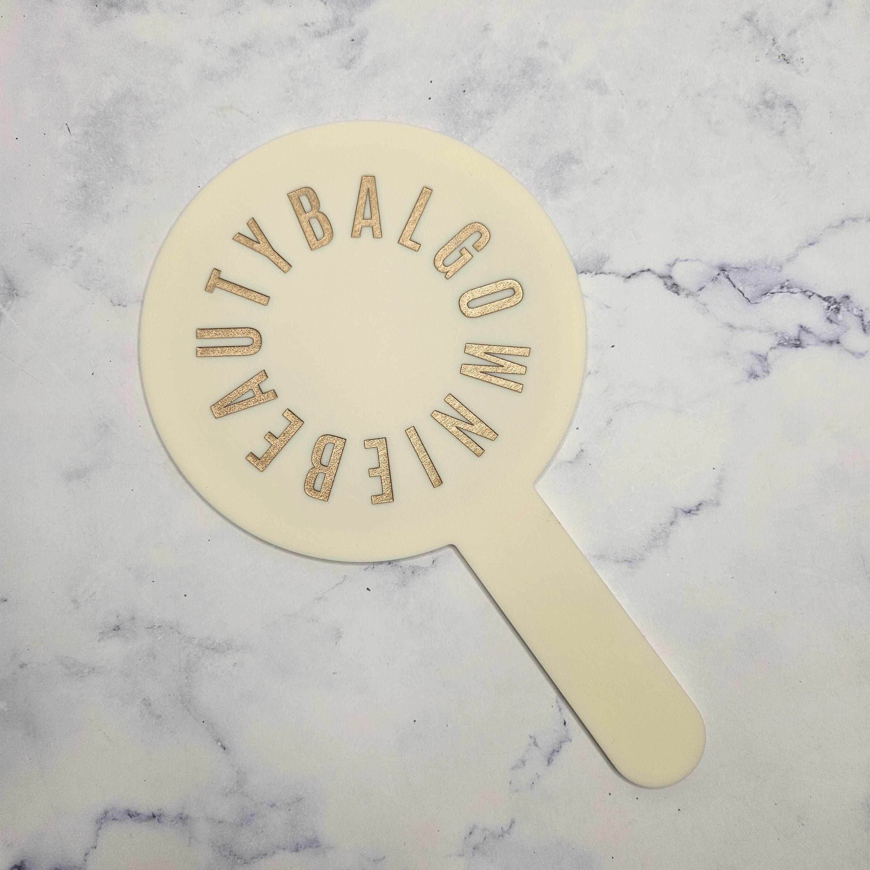 Round Handheld Mirror with Gold Logo and cream acrylic