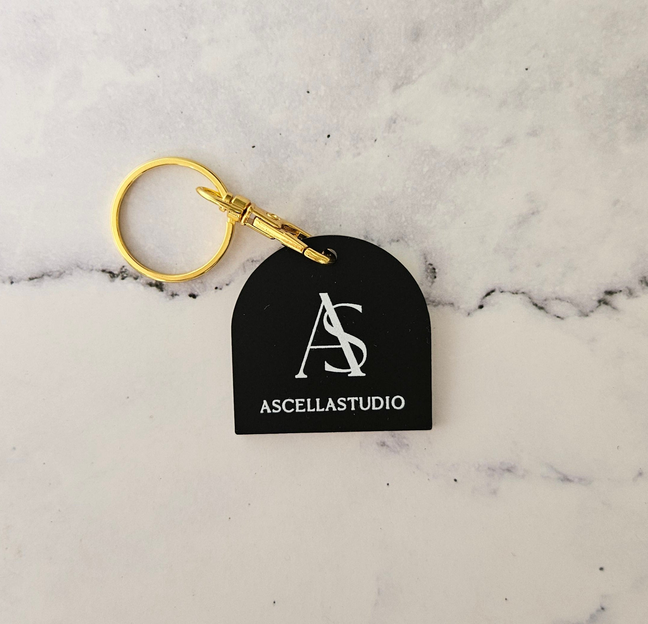 QR Code Keyring in arch shape with white logo on black acrylic