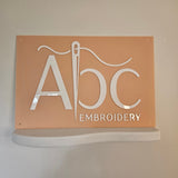 Soft Peach business sign with White  3D letters