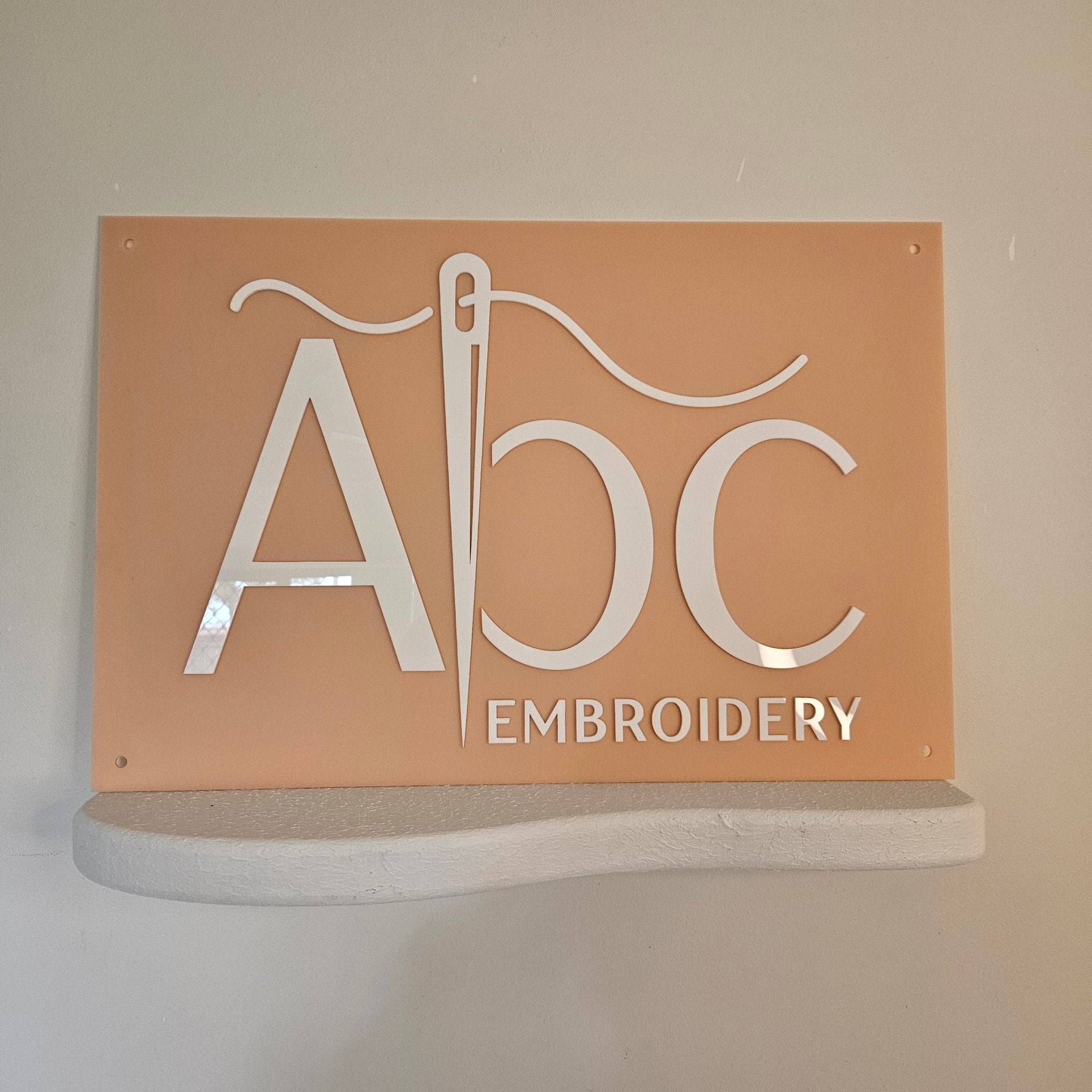 Soft Peach business sign with White  3D letters