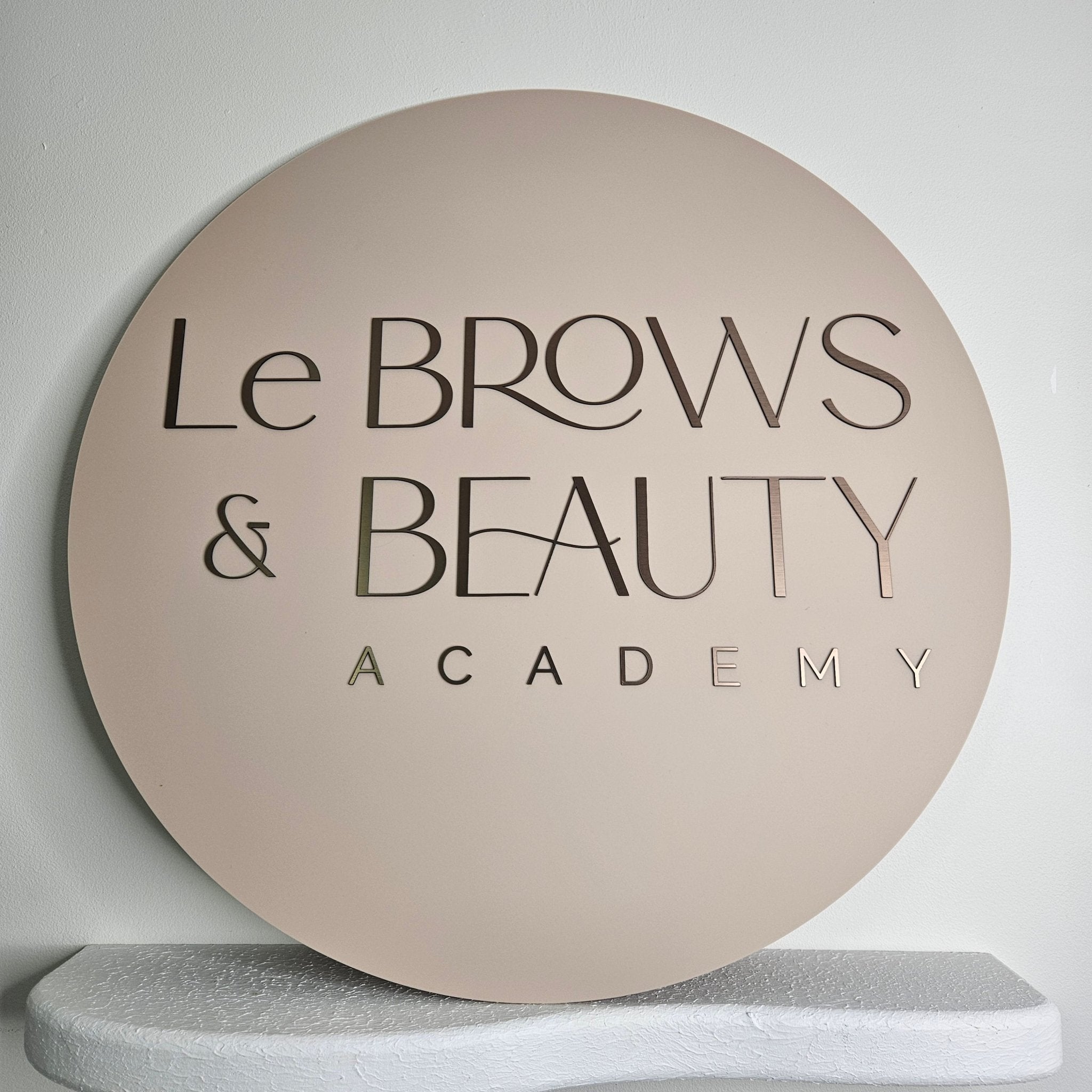 Round business sign (beige with brushed brown 3D letters)