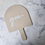 XL Arch Handheld Mirror in Almond Acrylic with White Logo