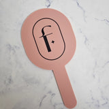 Oval handheld mirror in pink clay acrylic & custom logo colour