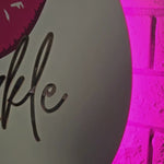 Custom Backlit Sign with pink lighting