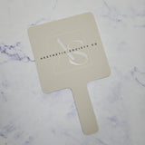 Square Handheld Mirror in Beige Acrylic & Black/White Logo